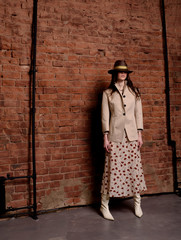 Fashionable photo. Girl model in fashionable clothes, studio shooting.