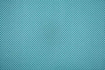 Outdoor-Kissen Close up of teal blue colored mesh textile fabric © Firn