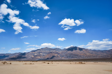 Fototapeta na wymiar Clouds over maointains in Death Valley National Park, USA