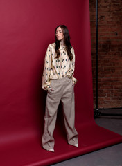 Fashionable photo. Girl model in fashionable clothes, studio shooting.