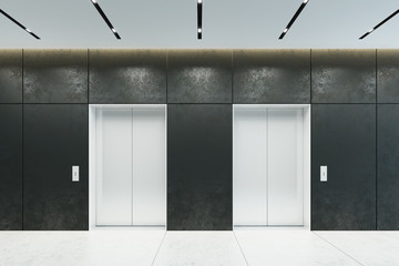 modern elevator with closed doors in office lobby, 3d rendering © auris