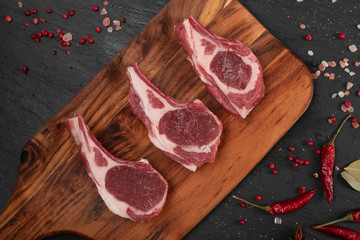 Raw Lamb Chops, Mutton Cuts or Sheep Ribs on Black