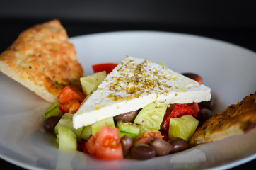 delicious greek salad with fresh ingredients & spices