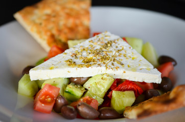 delicious greek salad with fresh ingredients & spices