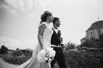 Beautiful wedding couple by the sea