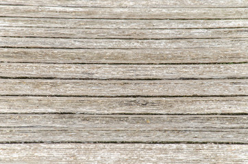 Fototapeta premium gray wooden background. Old dry boards. Wood texture. bridge or pier in the village near the river.