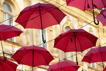 red umbrellas with orange background