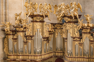 Church pipe-organ in the St. Barbara Cathedral, Czech Republic An elaborate baroque organ found in...