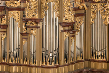 Church pipe-organ in the St. Barbara Cathedral, Czech Republic An elaborate baroque organ found in...