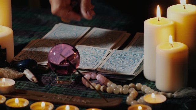 Hands gypsy folding tarot cards