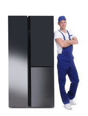 Professional worker near refrigerator on white background