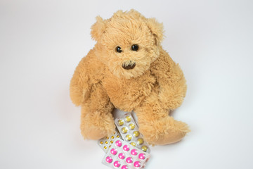 sick kids bear sit on floor closeup pills health save doctor