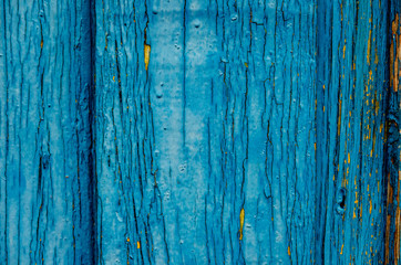 Fototapeta na wymiar Empty background painted wooden surface. Old blue paint on the board. Cracked and chipped. Wood texture.
