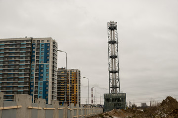 Construction of a new residential building. Apartments are made using brick-monolithic technology. First, pour concrete into the walls, build a frame. Then lay a brick for the walls. It turns out huge