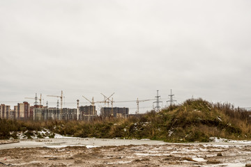 Construction of a new residential building. Apartments are made using brick-monolithic technology. First, pour concrete into the walls, build a frame. Then lay a brick for the walls. It turns out huge