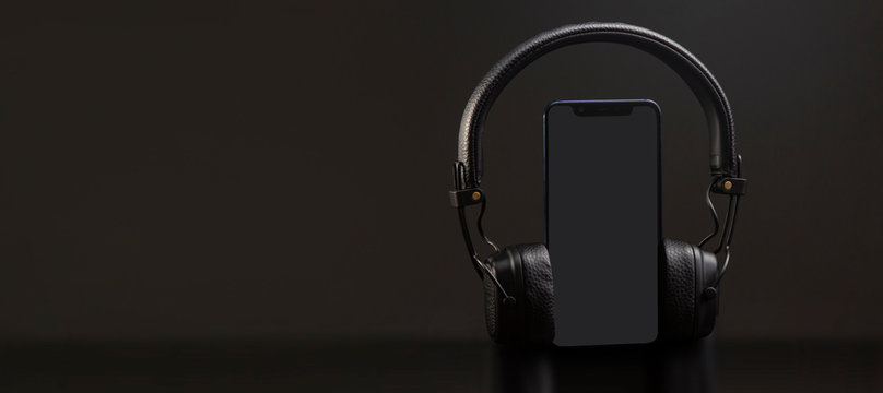 Black Headphones On Smartphone Music Online Concept, Mockup