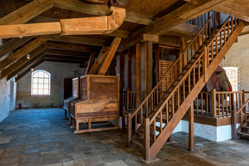 Interior of traditional mill with wooden equipment