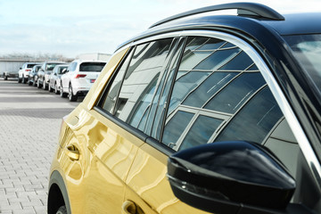 Modern car with tinting foil on window outdoors, closeup