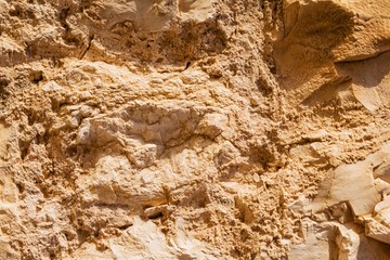 Wall sandstone texture background. Yellow old grunge surface, stone vintage texture. Voluminous background