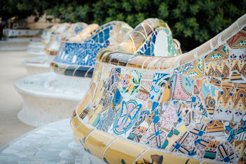 Details of a colorful ceramic bench at Parc Guell designed by Antoni Gaudi, Barcelona, Spain. - obrazy, fototapety, plakaty