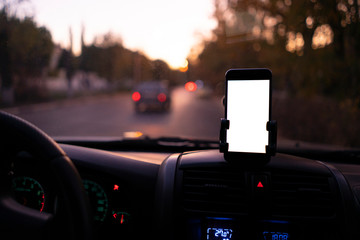 the mockup design of the smartphone attached to the windscreen inside the car