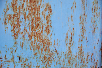 Grunge metal background painted in blue paint