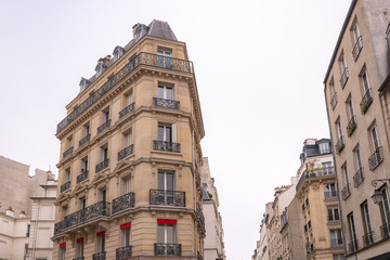 Fototapeta premium Paris, typical building, parisian facade and windows rue du Temple