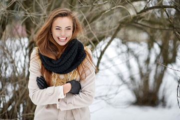 Laughing girl outdoor winter portrait