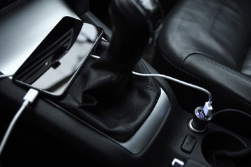  Mobile phone, smartphone charge battery , charging in the car plug close up