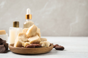 Organic cocoa butter on white wooden table