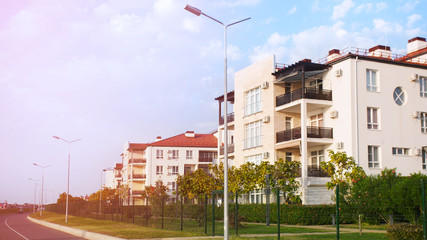 House roof on the background of the blue sky. View of new modern apartment house. Residential...