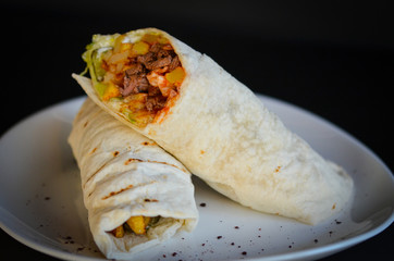 tasty beef roll dish with french fries & fresh vegetables