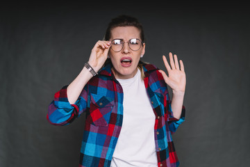Portrait of displeased woman with glasses