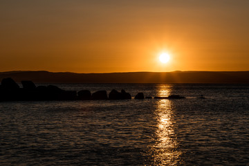 Obraz premium sunset on the beach in scotland