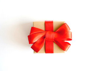 Gift box decorated with a red bow.