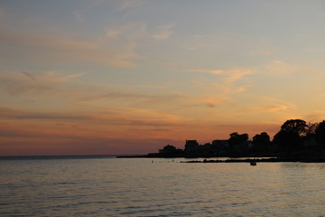 Fototapeta premium Beautiful New England coastal beach summer sunset