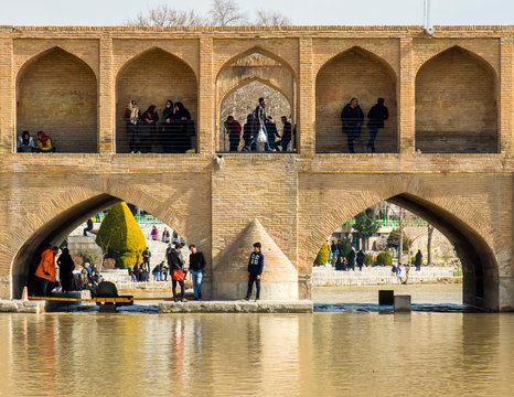 Isfahan, Iran - 2 February 2019: Si-o-seh pol Bridge. Also known as Allahverdi Khan and Allahverdi Khan or 33 arched bridge over the Zayandeh river.