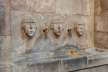 Public Drinking Fountain, Barcelona, Spain. Public Drinking Fountain of Three Men's Faces, Barcelona, Spain