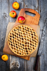 Traditional apple jalousie cake offered as top view on a modern design wooden board