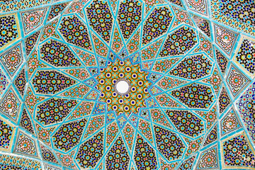 Shiraz, Iran - 31 January 2019: Geometric ceiling decoration of the tomb of popular iranian poet...