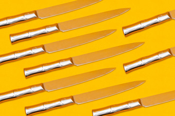 Knife seamless pattern on yellow background, cutting concept
