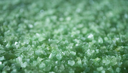 Green bath salt texture background. Top view.