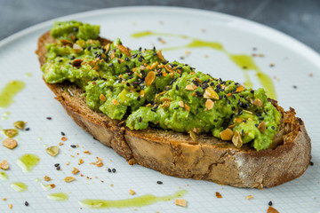 avocado toast on grey table