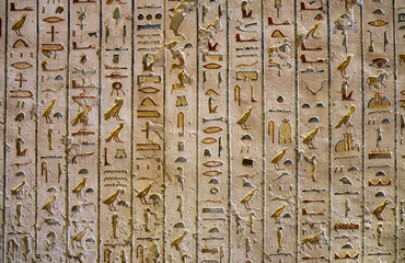 Relief details and Egyptian hieroglyphs at the pharaoh tomb in the Valley of the Kings in Luxor, Egypt