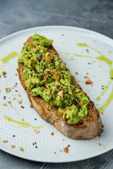 avocado toast on grey table