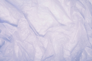Abstract texture of light crumpled transparent cellophane, polyethylene, recycling, ecology concept, environmental pollution