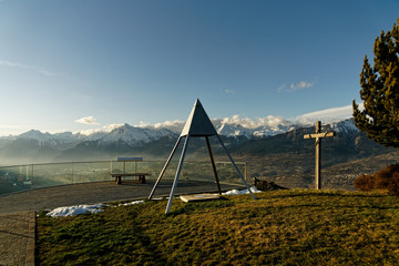 Belvedere triangulation point. Balcony of the Sky and its glass railing. Panorama of the Jausses....