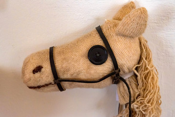 Close up toy horse head made of soft cloth