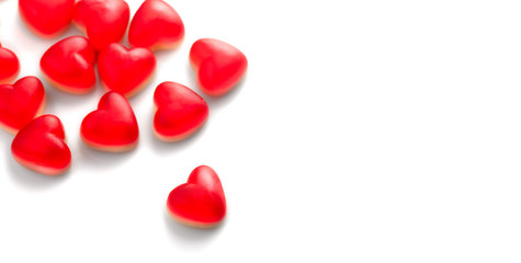 Heart shaped jelly candy, love background. Red jelly sweets candies on white backdrop. St....