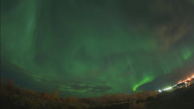 Aurora borealis in the night northern sky. Ionization of air particles in the upper atmosphere.